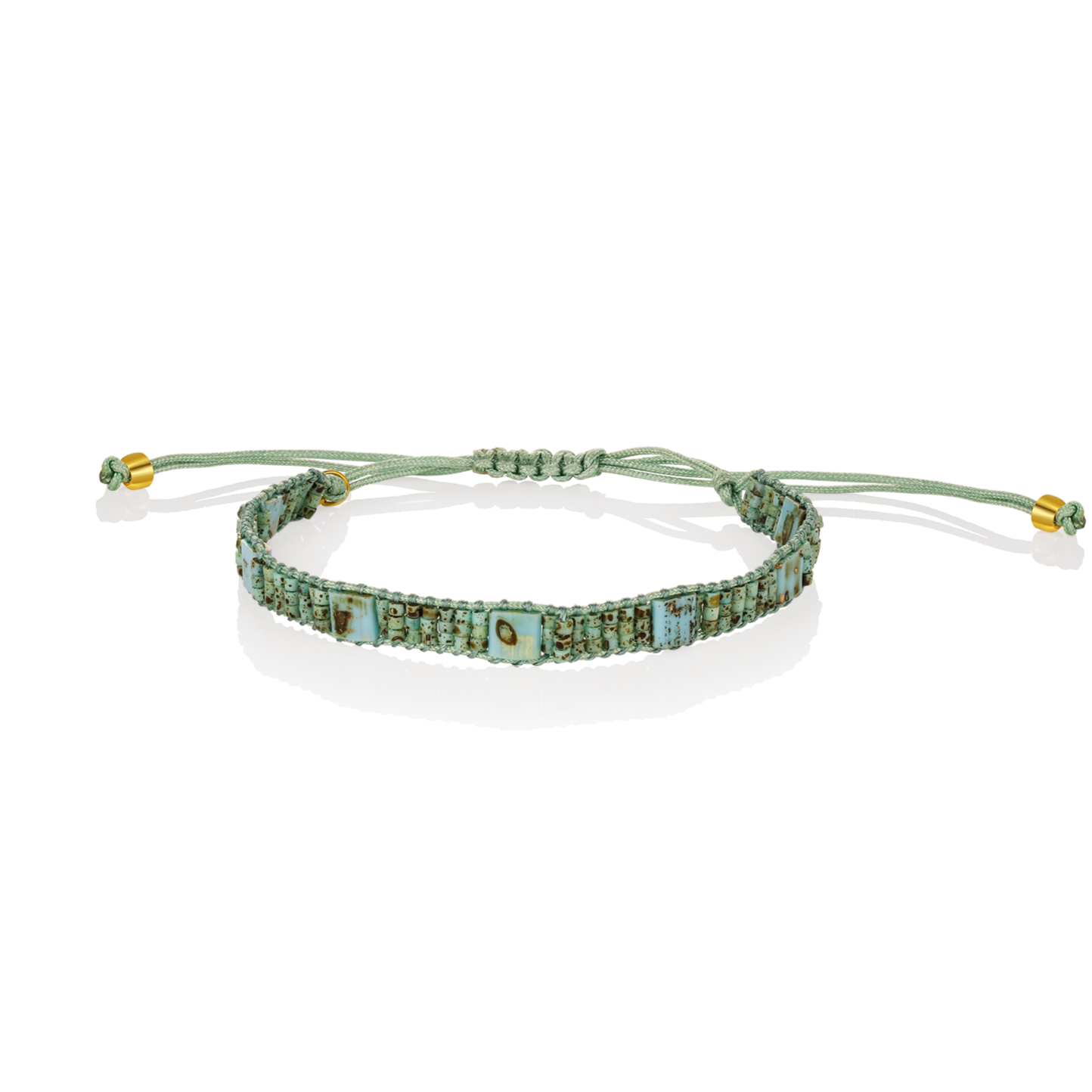 Turquoise beaded bracelet with gold accents on a white background