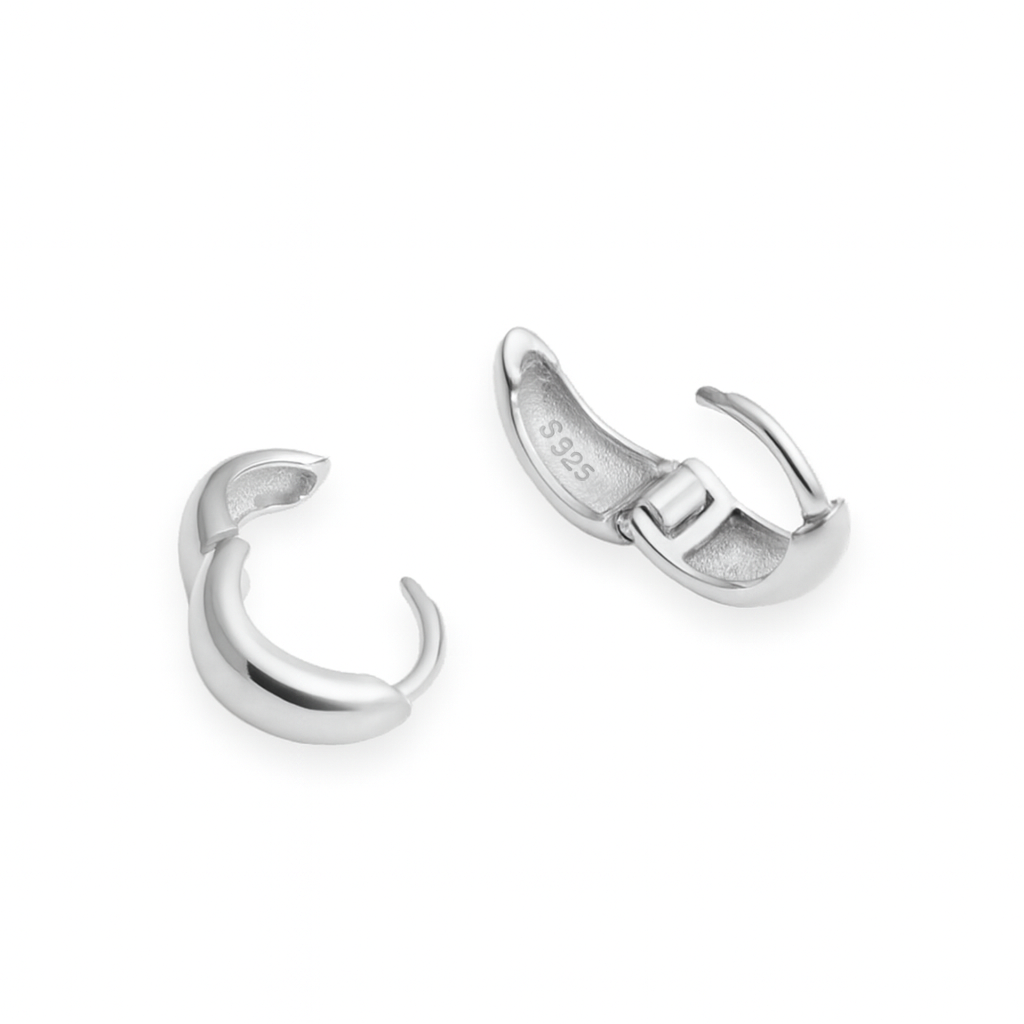 Pair of silver hoop earrings on a white background