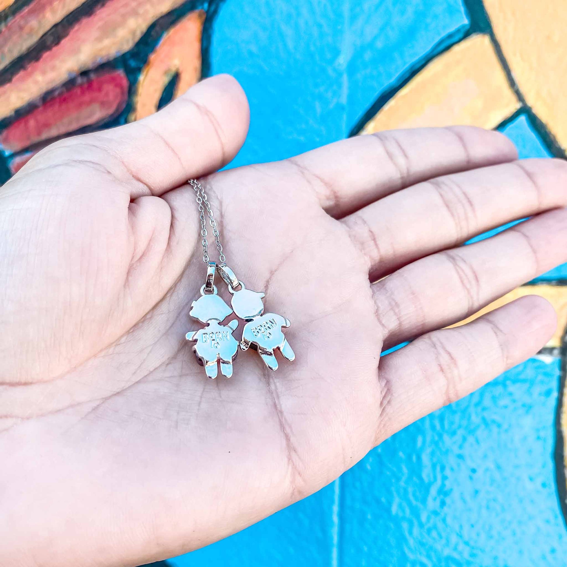 We're donating a $1 of each little girl and little boy pendants to "Pés Livres", which is providing food and education to more than 50 children in Tanzania, Africa.