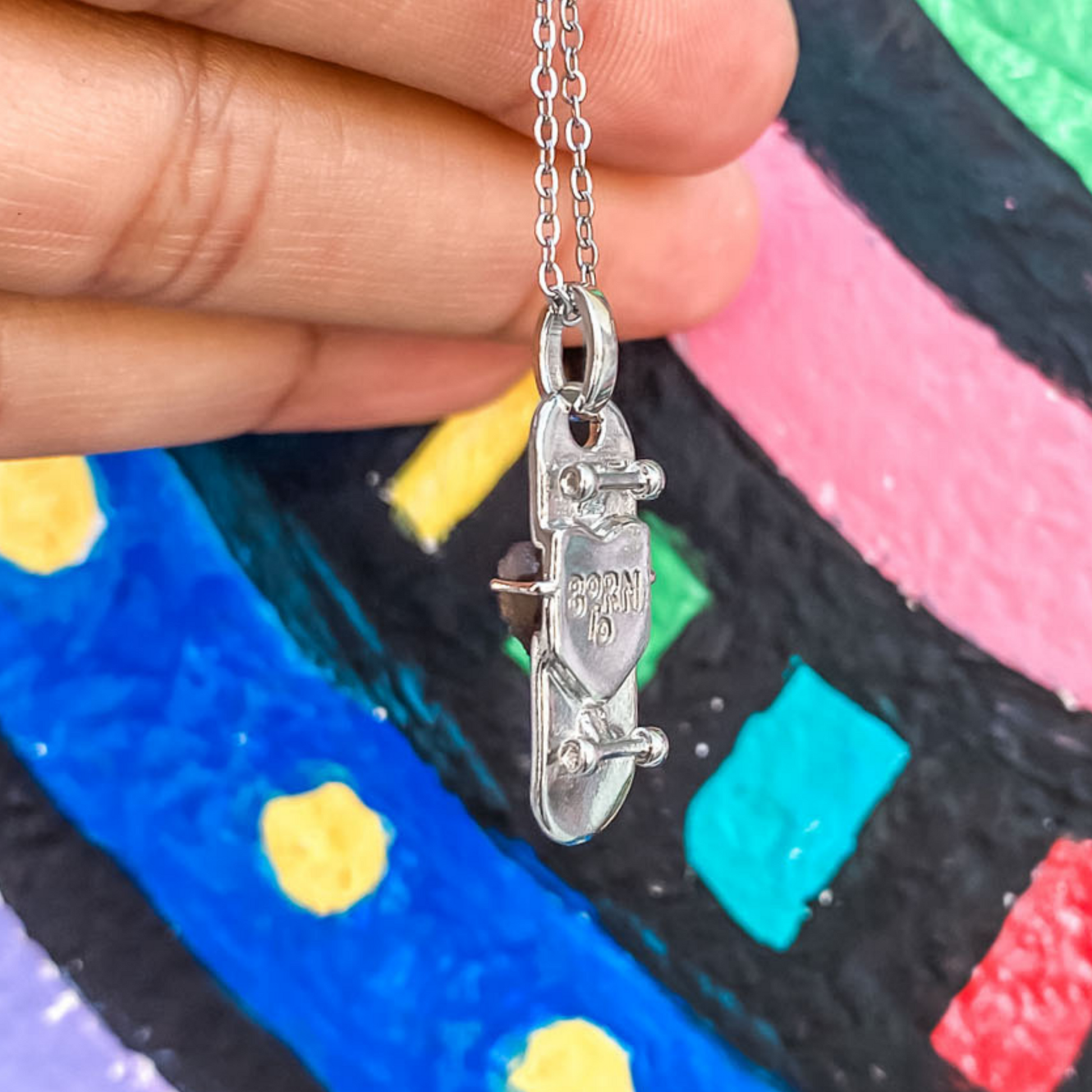 silver plated skateboard charm necklace with a multicolor crystal druzy by born to rock jewelry
