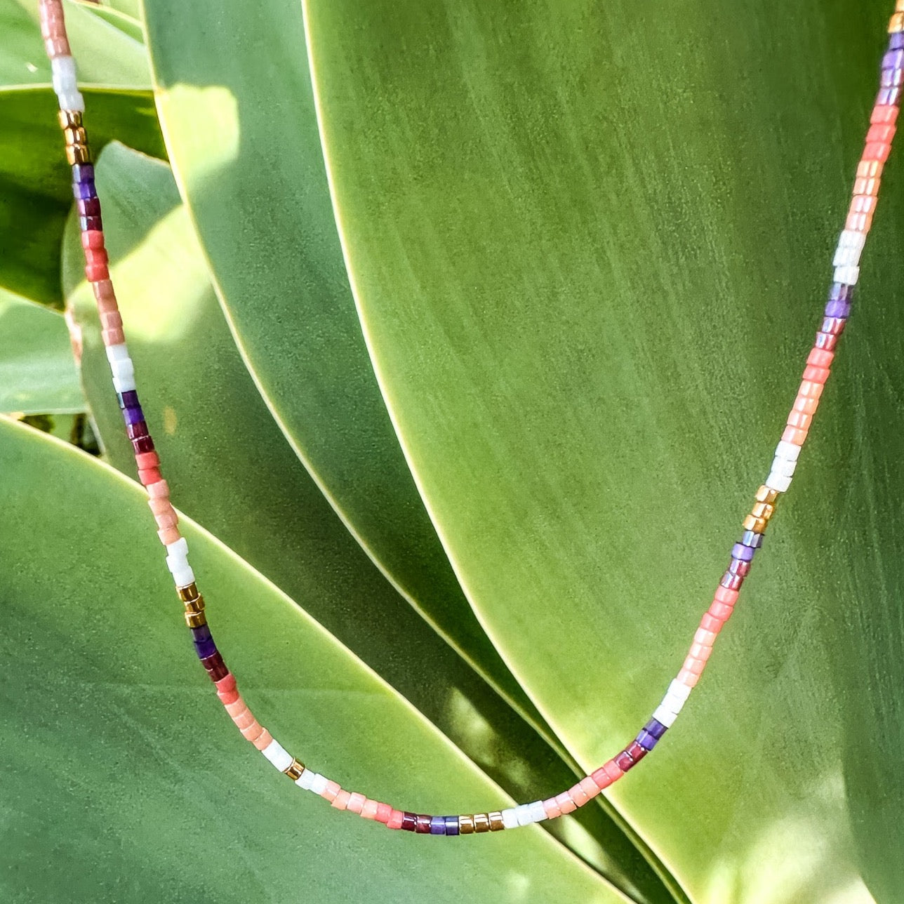 Handmade beaded necklace, adjustable necklace made with colored beads, layered necklaces, surf jewelry made by Born to Rock Jewelry, Family owned sports inspired and lifestyle jewelry brand based in San Diego, California