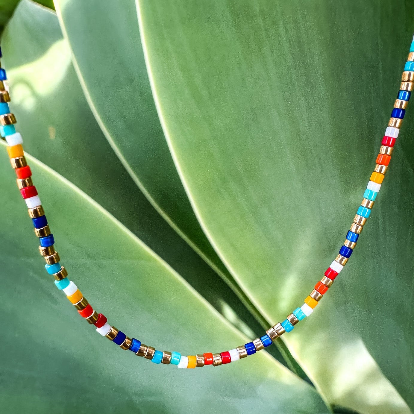 Handmade beaded necklace, adjustable necklace made with colored beads, layered necklaces, surf jewelry made by Born to Rock Jewelry, Family owned sports inspired and lifestyle jewelry brand based in San Diego, California