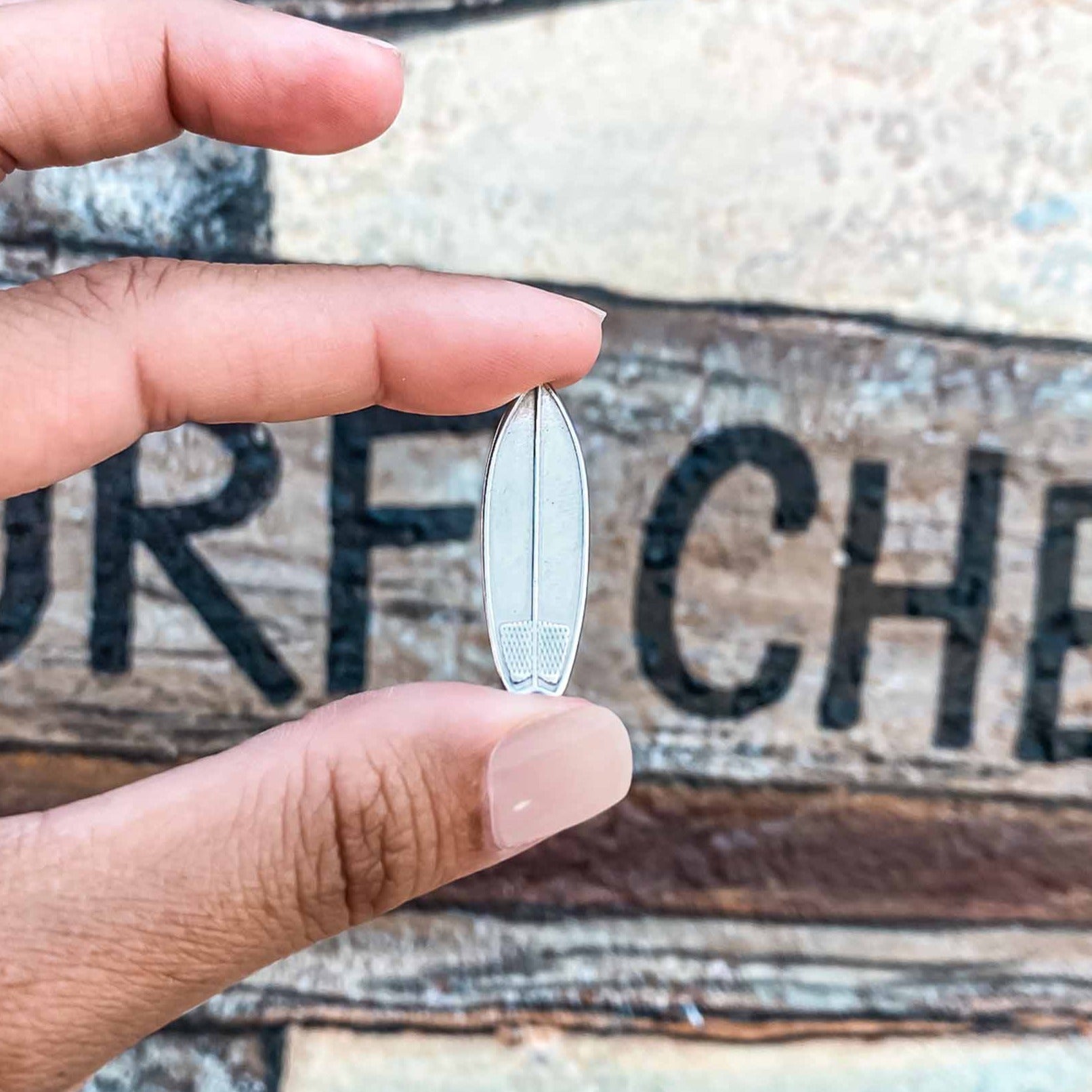 Silver plated surfboard charm necklace made by Born to Rock jewelry. Online jewelry store based in San Diego California. Great gift for surfers