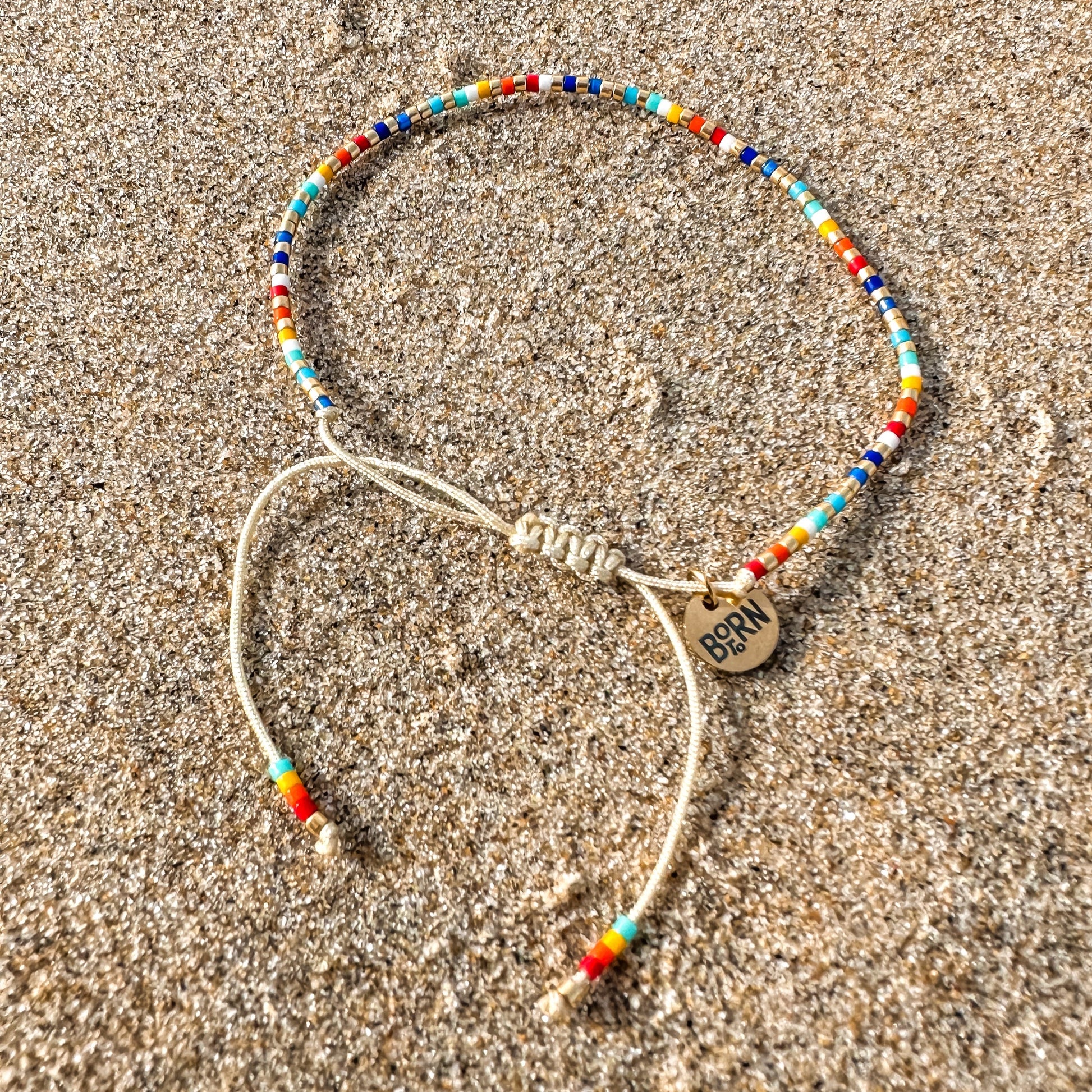 Beaded bracelet, adjustable bracelet made with colored beads, friendship bracelet, Surf Jewelry made by Born to Rock Jewelry, Family owned sports inspired and lifestyle jewelry brand based in San Diego, California