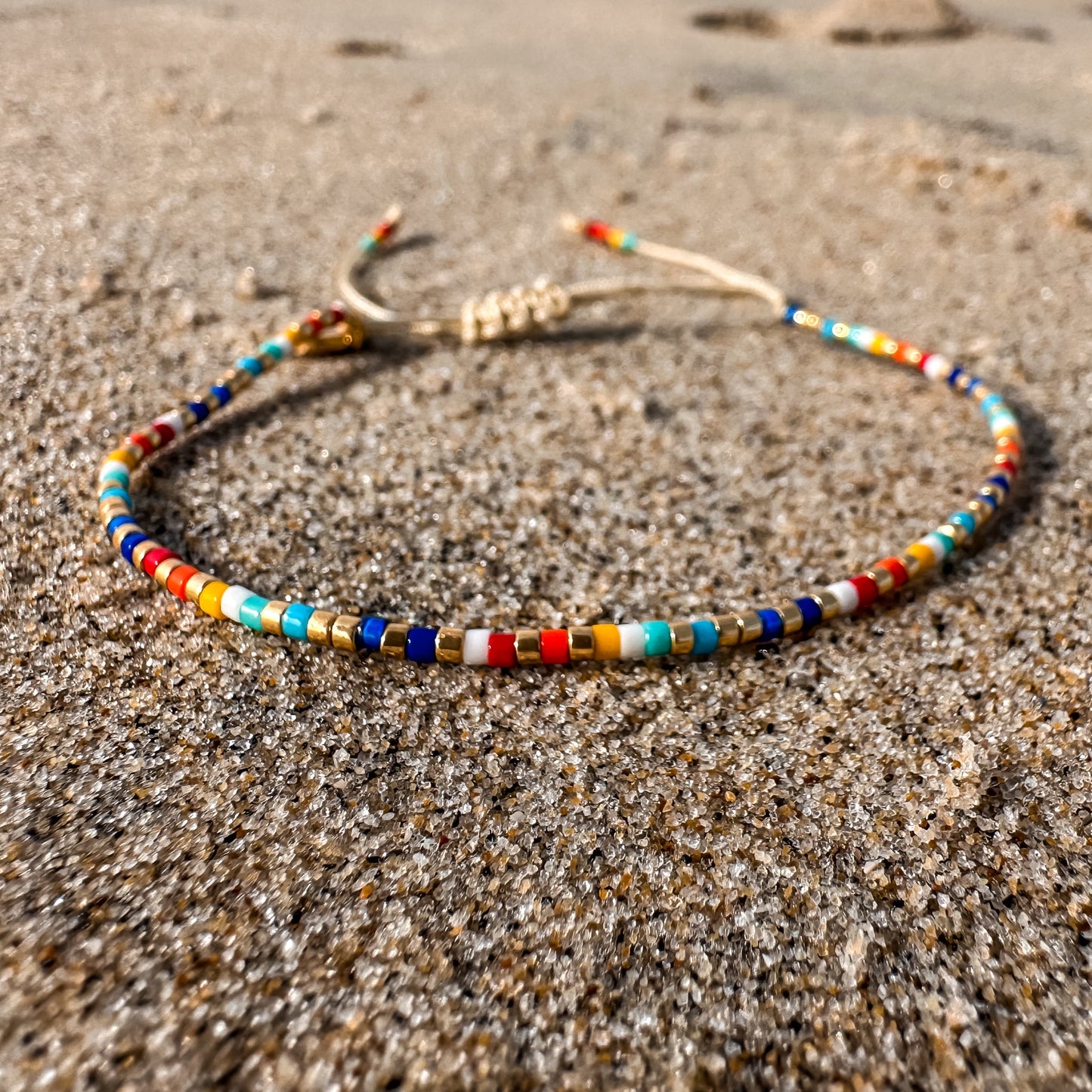 Beaded bracelet, adjustable bracelet made with colored beads, friendship bracelet, Surf Jewelry made by Born to Rock Jewelry, Family owned sports inspired and lifestyle jewelry brand based in San Diego, California