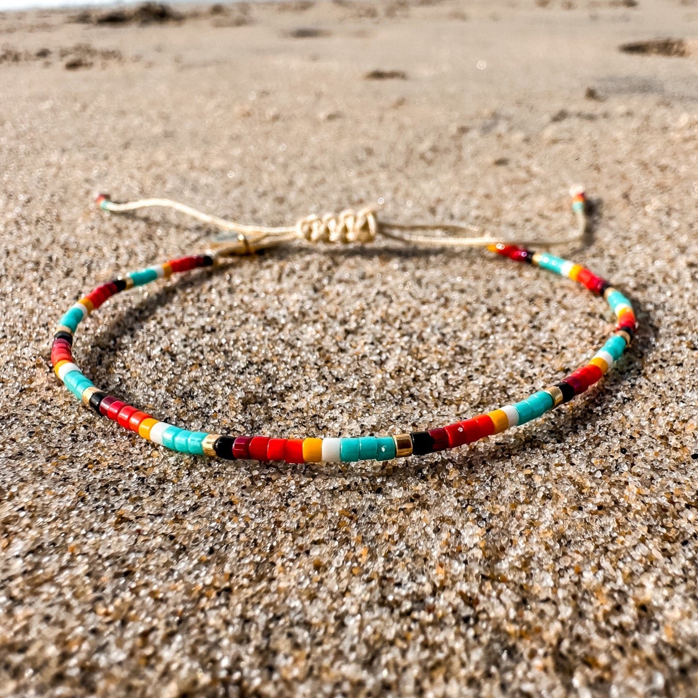 Beaded bracelet, adjustable bracelet made with colored beads, friendship bracelet, Surf Jewelry made by Born to Rock Jewelry, Family owned sports inspired and lifestyle jewelry brand based in San Diego, California