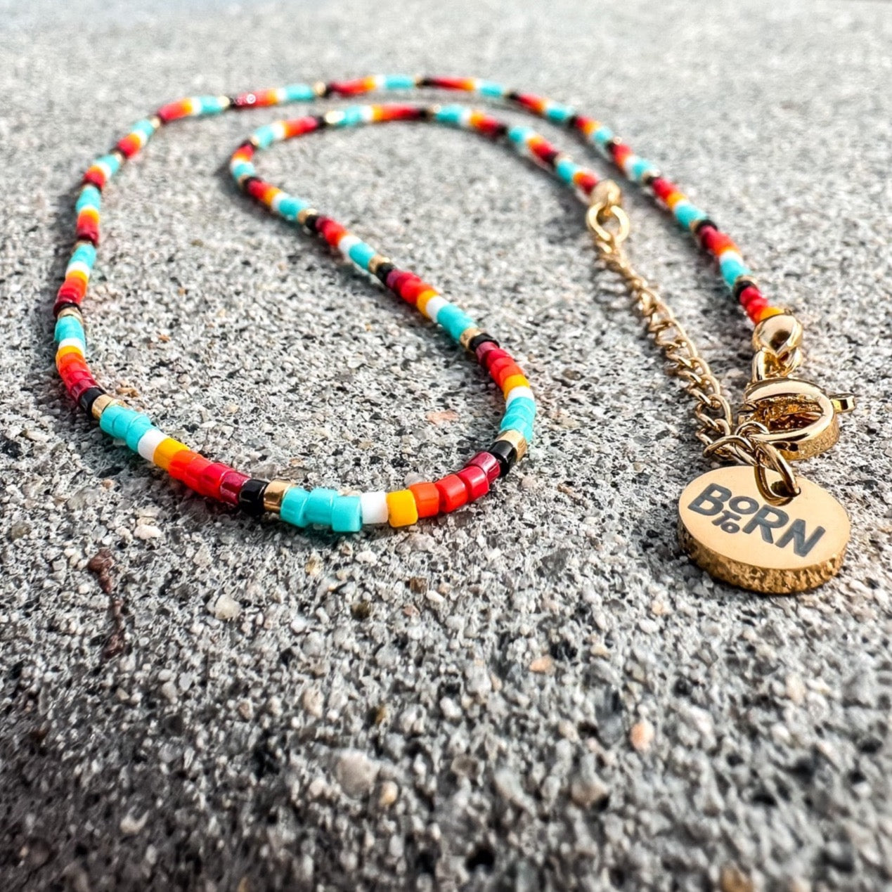 Handmade beaded necklace, adjustable necklace made with colored beads, layered necklaces, surf jewelry made by Born to Rock Jewelry, Family owned sports inspired and lifestyle jewelry brand based in San Diego, California