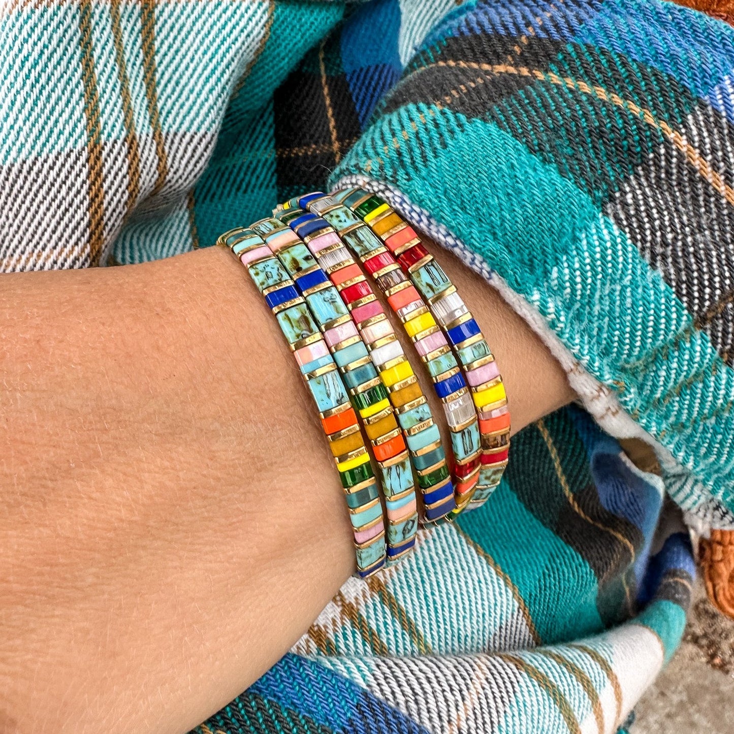 Colored tila beads stretch handmade bracelets made by Born to Rock Jewelry. Surf and sports inspired jewelry brand. A family-owned business that rocks! Based in San Diego California.