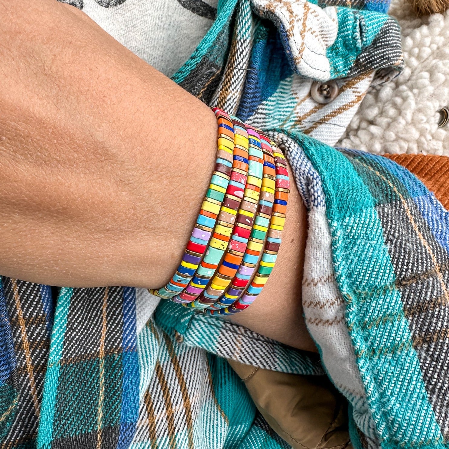 Colored tila beads stretch handmade bracelets made by Born to Rock Jewelry. Surf and sports inspired jewelry brand. A family-owned business that rocks! Based in San Diego California.