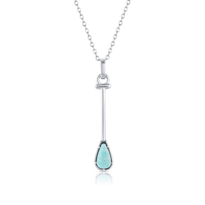 Silver necklace with a turquoise pendant on a white background