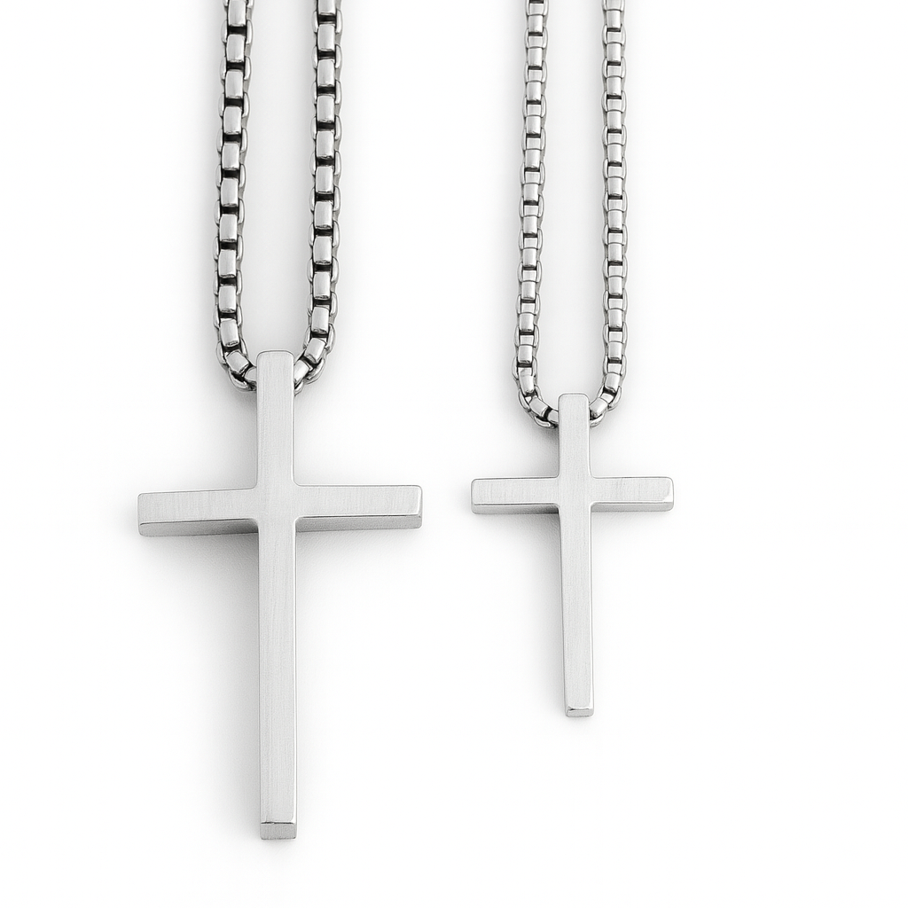 Two silver cross necklaces on white background