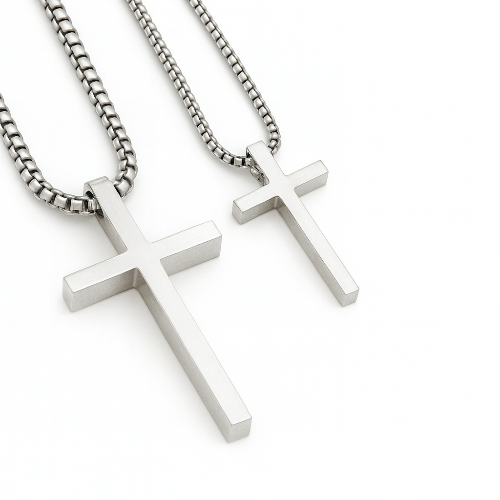 Two silver cross necklaces on white background