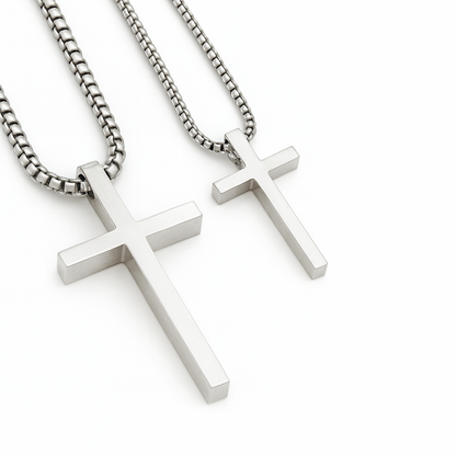 Two silver cross necklaces on white background