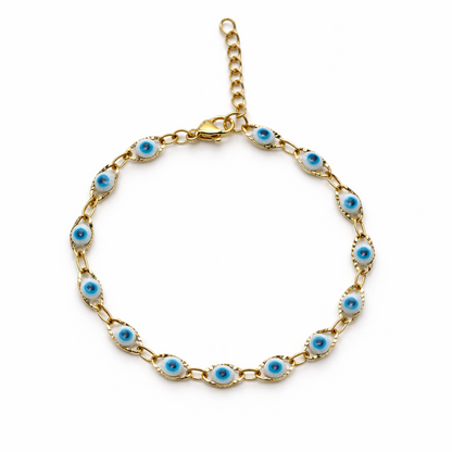 Gold bracelet with blue and white evil eye beads on a white background