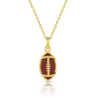 Gold necklace with a football-shaped pendant on a white background