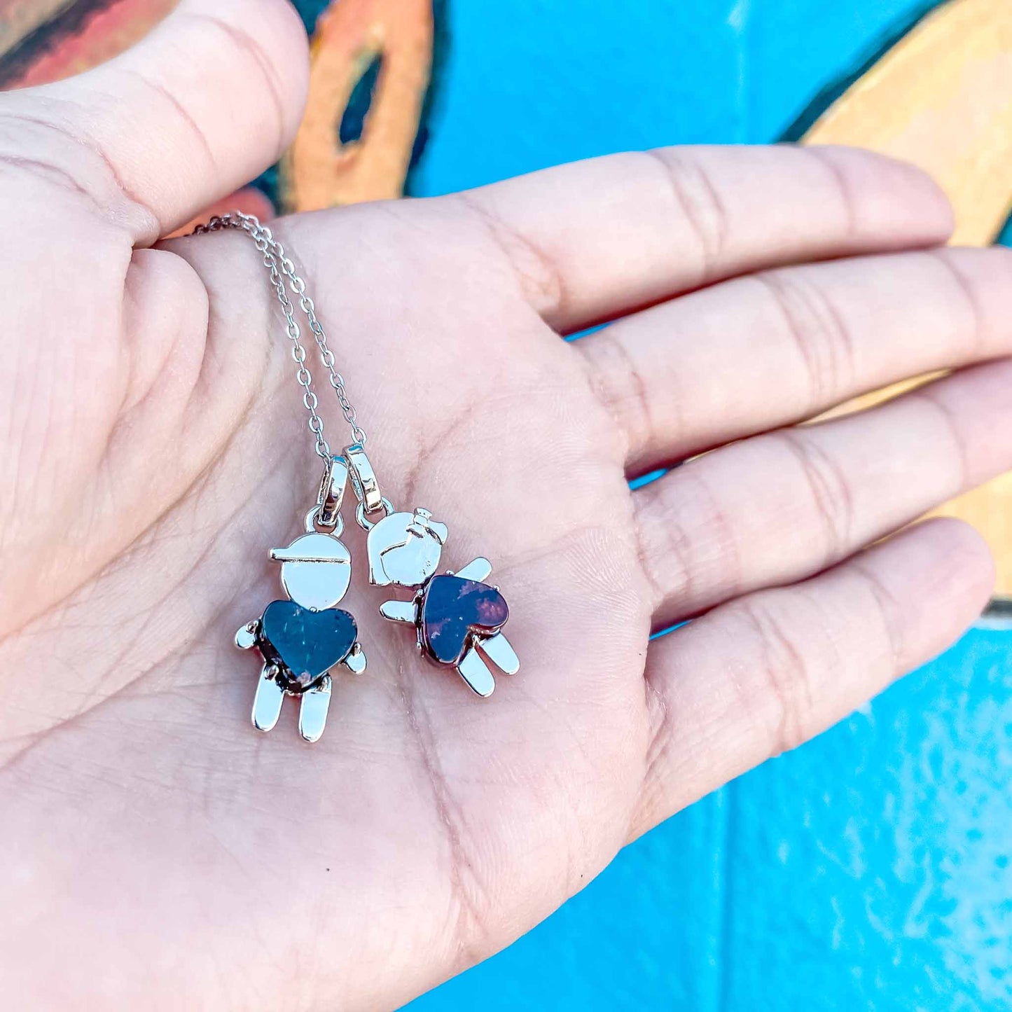 We're donating a $1 of each little girl and little boy pendants to "Pés Livres", which is providing food and education to more than 50 children in Tanzania, Africa.