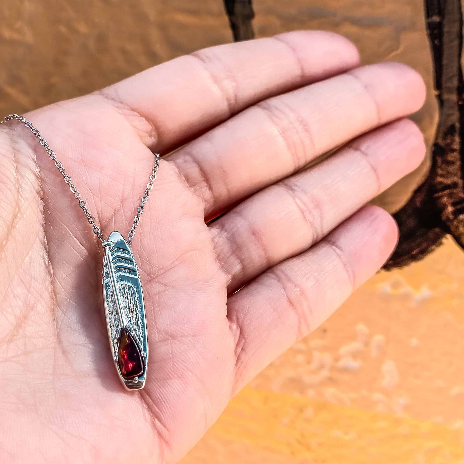 Looking for places to buy or rent a paddle board? This stand up paddle board pendant will be the best and highest performance SUP you'll ever find. Take your paddle board with you, even when you're not surfing, racing or touring. Shop January's birthstone SUP jewelry online or at a surf shop near you.