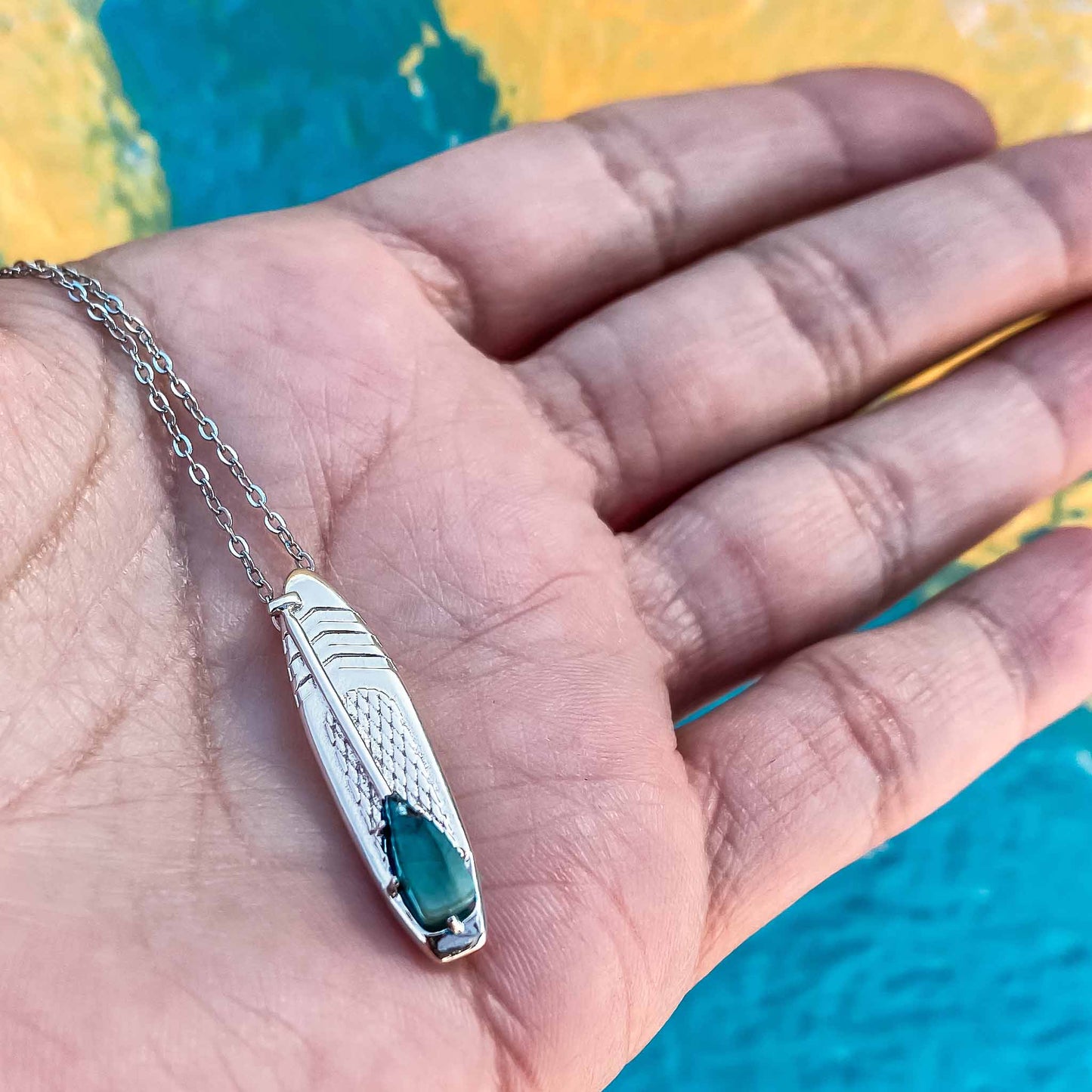 Looking for places to buy or rent a paddle board? This stand up paddle board pendant will be the best and highest performance SUP you'll ever find. Take your paddle board with you, even when you're not surfing, racing or touring. Shop May's birthstone SUP jewelry online or at a surf shop near you.