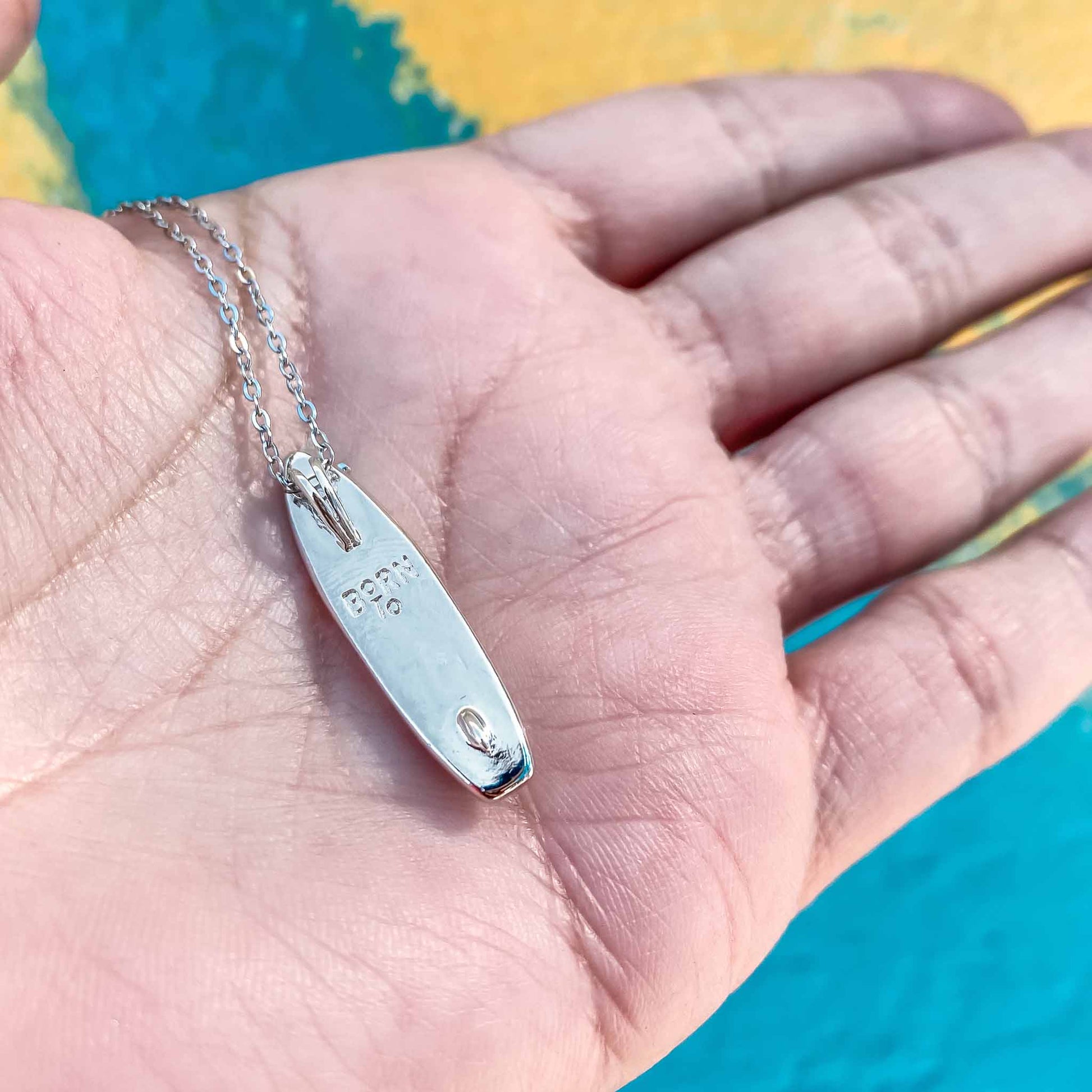 Looking for places to buy or rent a paddle board? This stand up paddle board pendant will be the best and highest performance SUP you'll ever find. Take your paddle board with you, even when you're not surfing, racing or touring. Shop May's birthstone SUP jewelry online or at a surf shop near you.