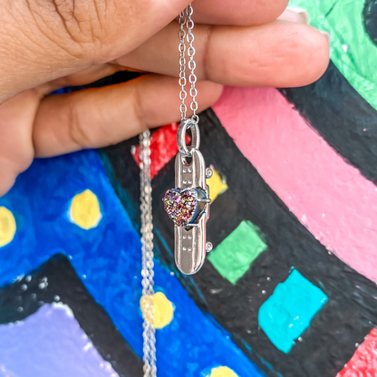silver plated skateboard charm necklace with a multicolor crystal druzy by born to rock jewelry