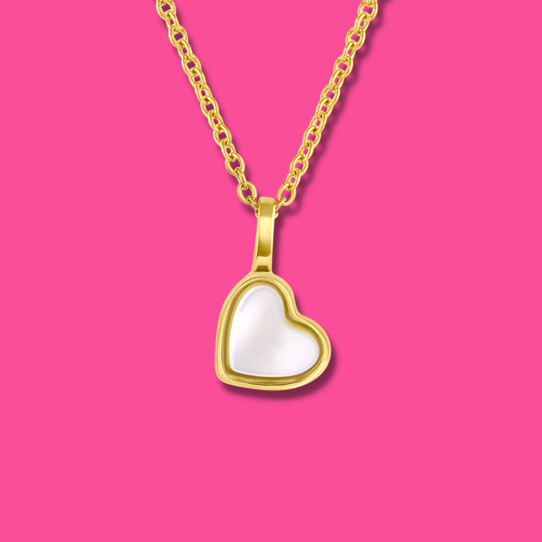 Yellow Gold plated charm necklace with a heart shaped mother-of-pearl pendant. Wedding and bridal jewelry. Great gift fro brides, bridesmaid and maid of honor made by Born to Rock . Jewelry store based in San Diego California