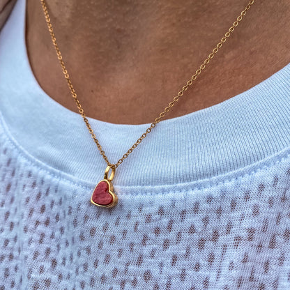 Yellow gold charm necklace with a heart shaped red feldspar natural gemstone. Made by Born to Rock. Online  jewelry store based in San Diego California