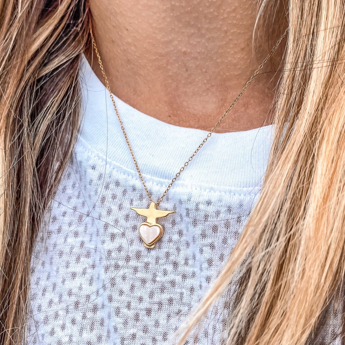 Christ the Redeemer Pendant Necklace in yellow gold plated with a heart shaped mother of pearl made by Born to Rock Jewelry