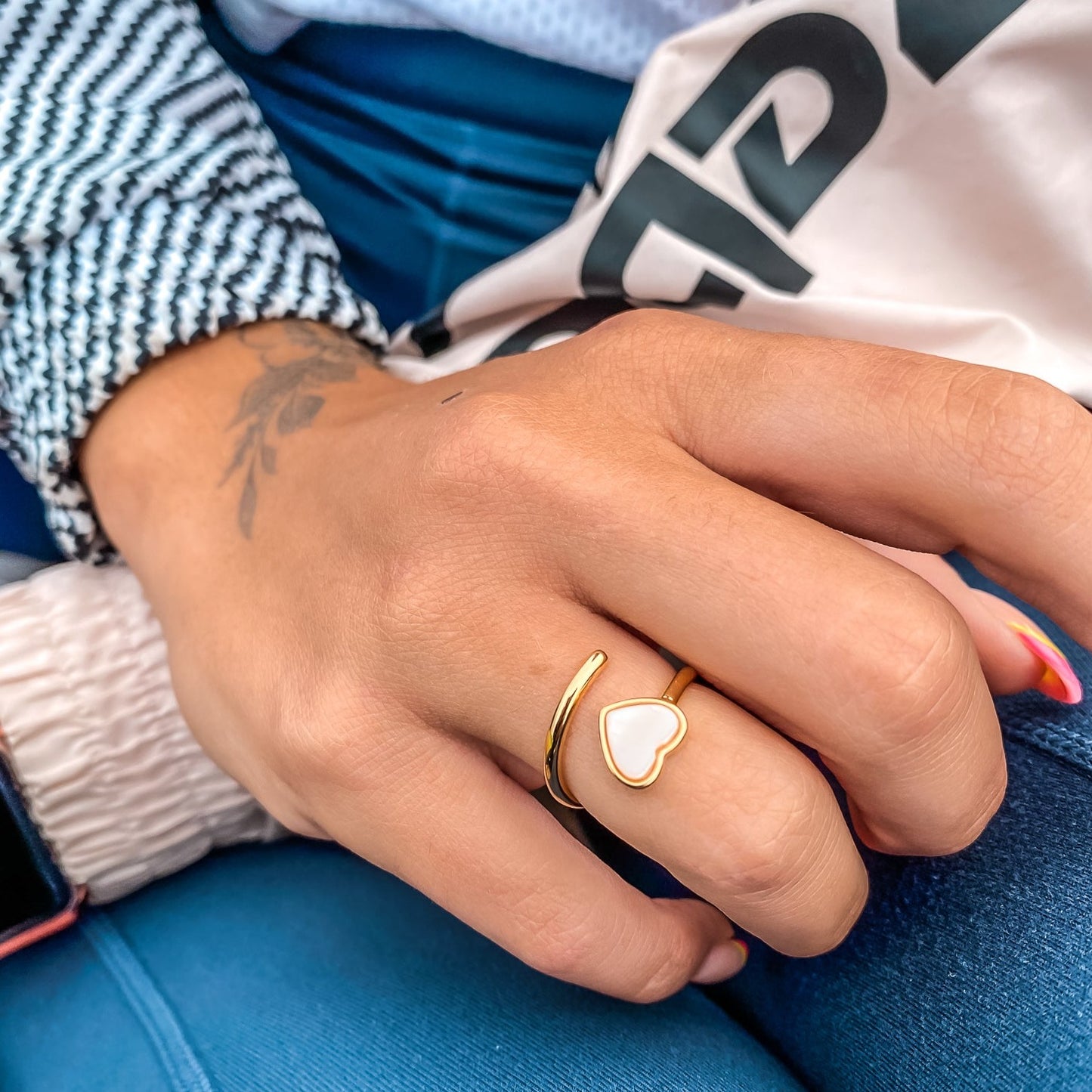 Yellow gold adjustable ring with a heart shaped mother-of-pearl. Wedding and bridal jewelry. Great gift for brides, bridesmaid and maid of honor. Made by  Born to Rock. Online Jewelry store based in San Diego California