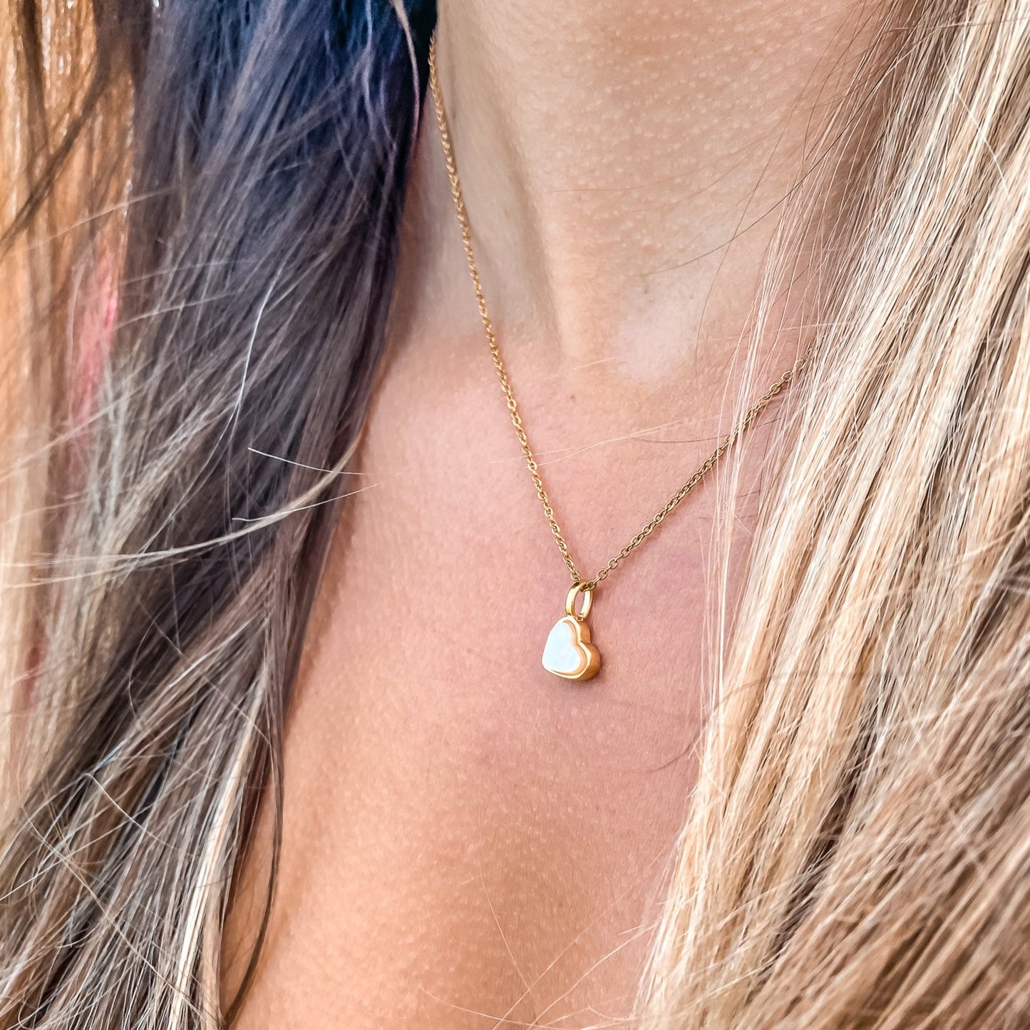 Yellow Gold plated charm necklace with a heart shaped mother-of-pearl pendant. Wedding and bridal jewelry. Great gift fro brides, bridesmaid and maid of honor made by Born to Rock . Jewelry store based in San Diego California