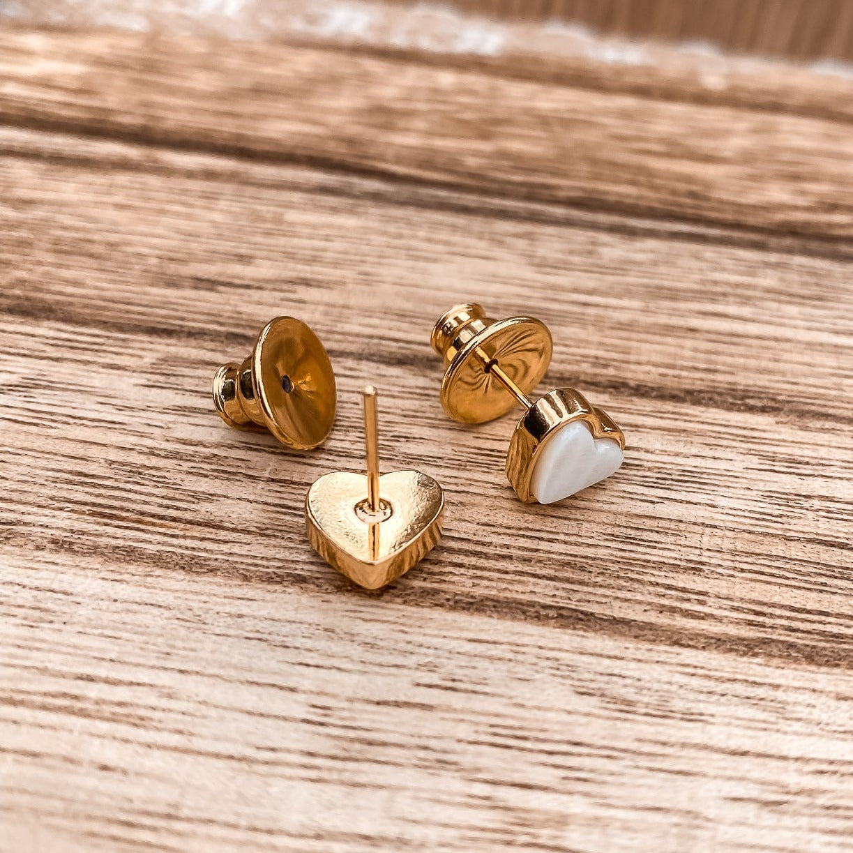 Yellow Gold plated earrings with a heart shaped mother-of-pearl pendant. Wedding and bridal jewelry. Great gift fro brides, bridesmaid and maid of honor made by Born to Rock . Jewelry store based in San Diego California