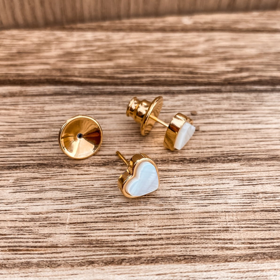 Yellow Gold plated earrings with a heart shaped mother-of-pearl pendant. Wedding and bridal jewelry. Great gift fro brides, bridesmaid and maid of honor made by Born to Rock . Jewelry store based in San Diego California