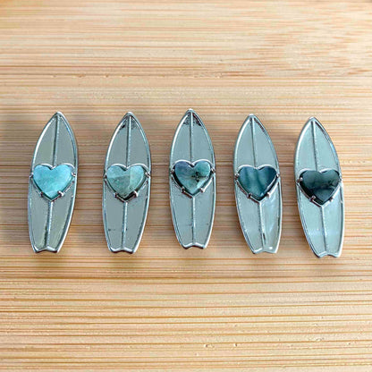 What's the surf forecast for today? While Surfline helps with the swell, wind & wave forecasts we help you show off your passion for surfing. Whether you're surfing or just checking the waves at Pipeline, take your surfboard, always. Shop the May's birthstone surf jewelry online or at a surf shop near you.