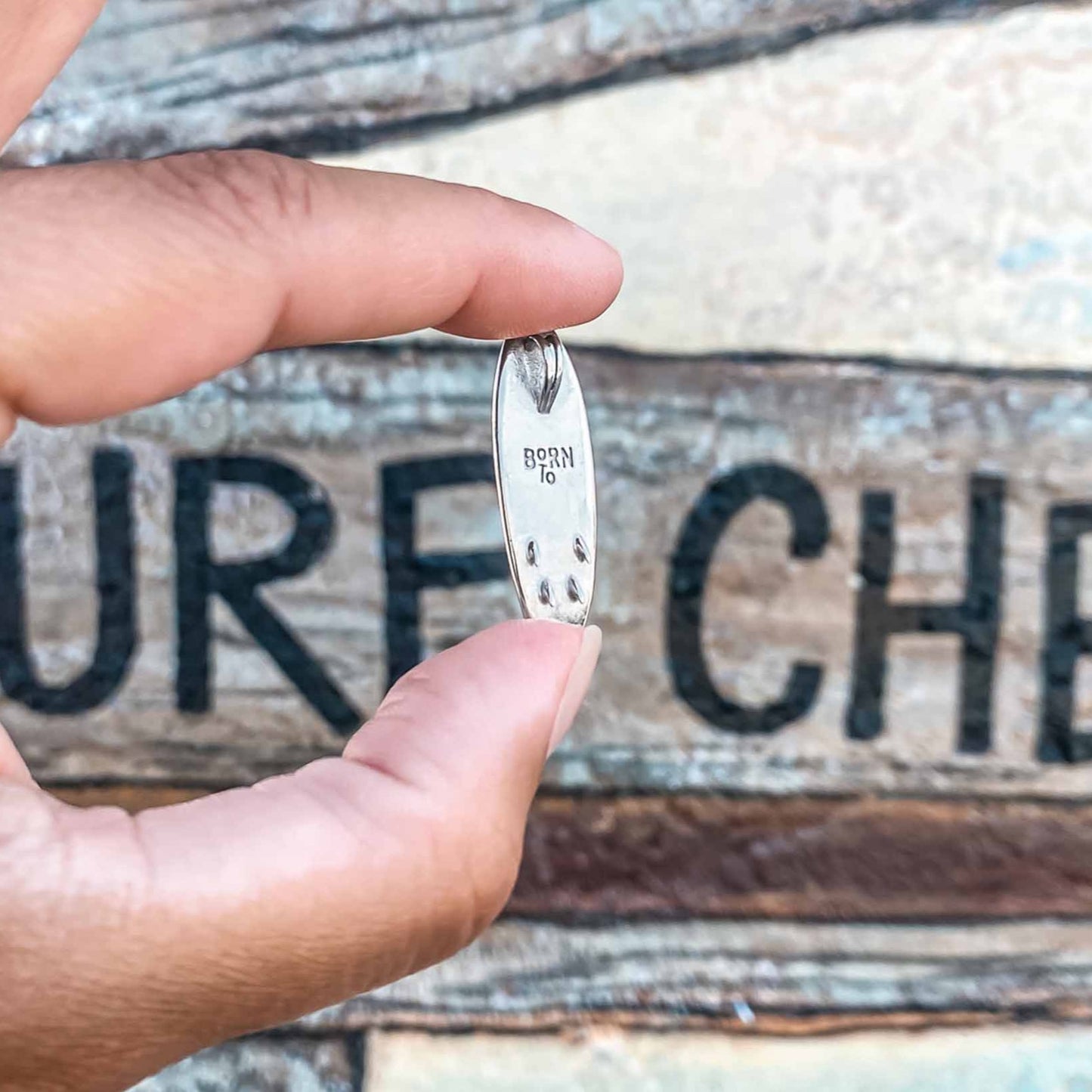 silver surfboard charm necklace. Surf inspired jewelry. Great gift for surfers made by Born to Rock. Designed in San Diego, California