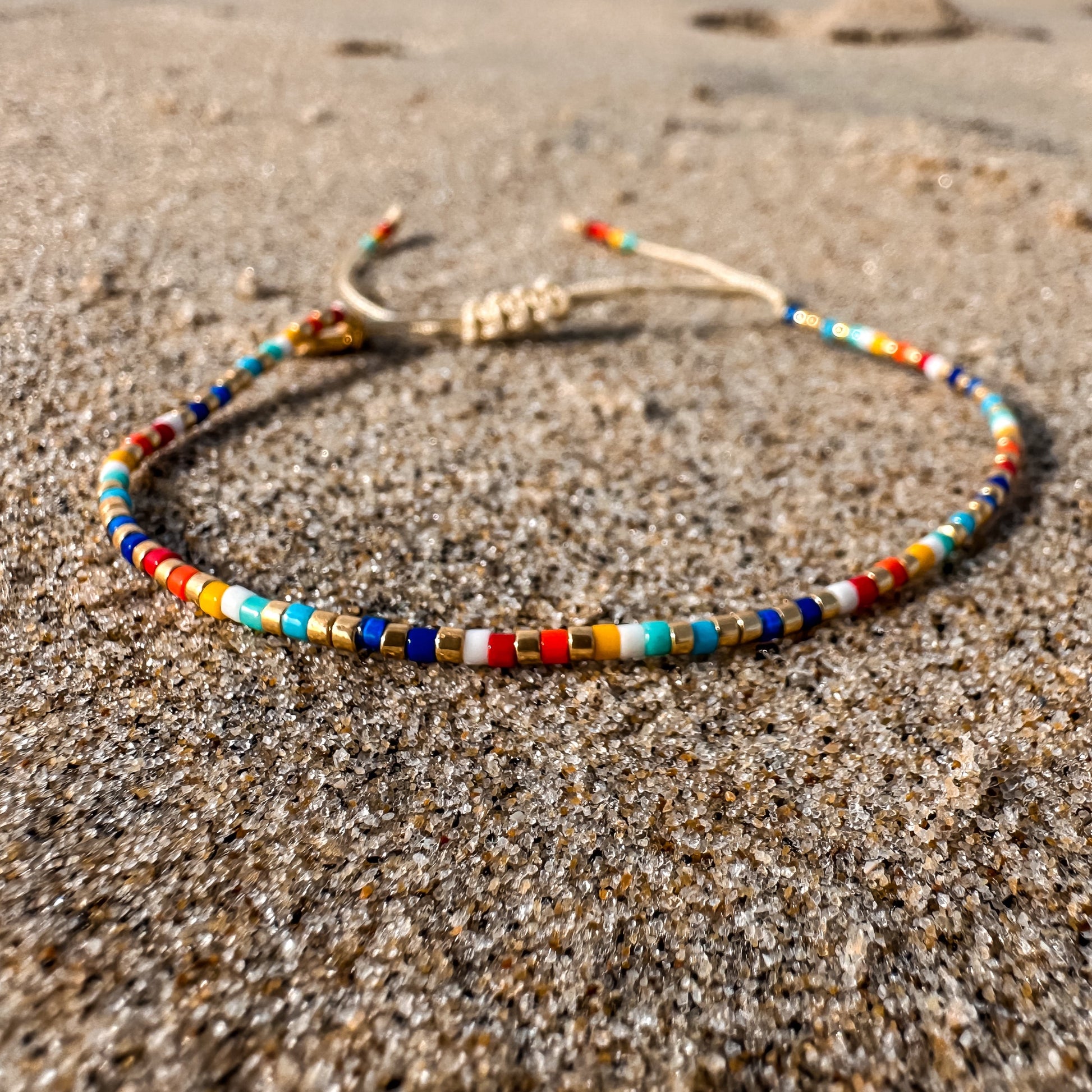 Beaded bracelet, adjustable bracelet made with colored beads, friendship bracelet, Surf Jewelry made by Born to Rock Jewelry, Family owned sports inspired and lifestyle jewelry brand based in San Diego, California