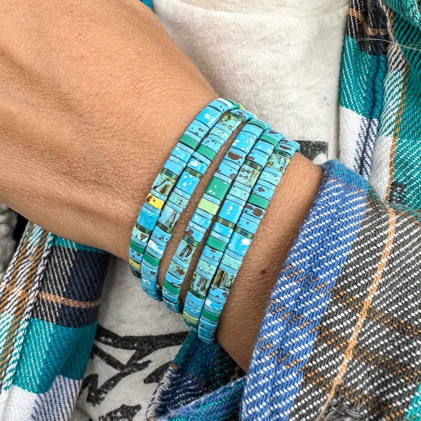 Colored tila beads stretch handmade bracelets made by Born to Rock Jewelry. Surf and sports inspired jewelry brand. A family-owned business that rocks! Based in San Diego California.